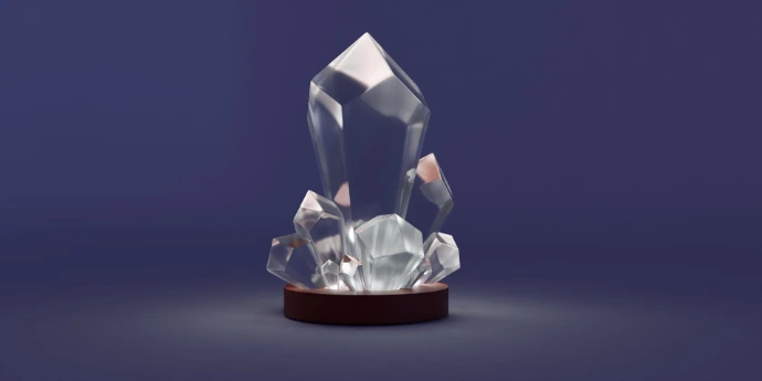 A crystal trophy with a wooden base on a blue background